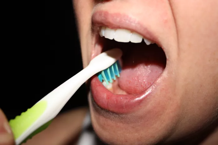 Brush the Top Surfaces of the Teeth